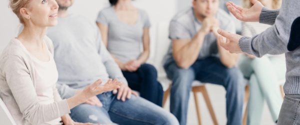 Woman talking with man during therapy for couples with problems